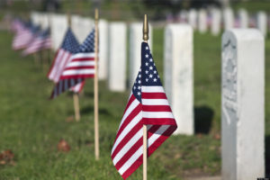 US flags at graves at Veterans cemetery